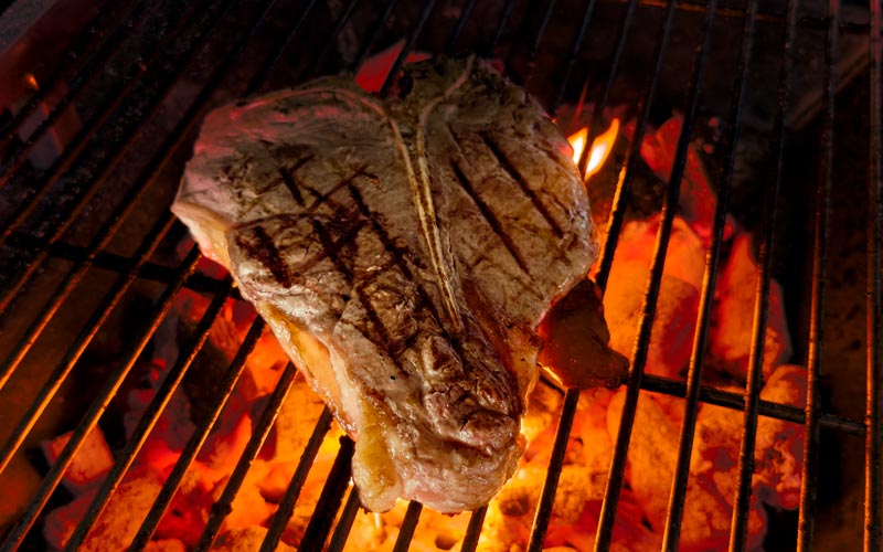 PalmBeach Tropical Restaurant | The Fiorentina (price per 100 grams) | (every Tuesday and Friday exclusive and limited stock,  reservations are a must) is a meat lover’s dream: thick, with a T-bone, seared to perfection with a crispy crust that gives way to a tender, juicy interior cooked rare. A drizzle of olive oil and a pinch of salt is all it needs to bring out its smoky, authentic flavors. Paired with a glass of Chianti, Rosso or Brunello di Montalcino, it’s the taste of Tuscany on a plate.