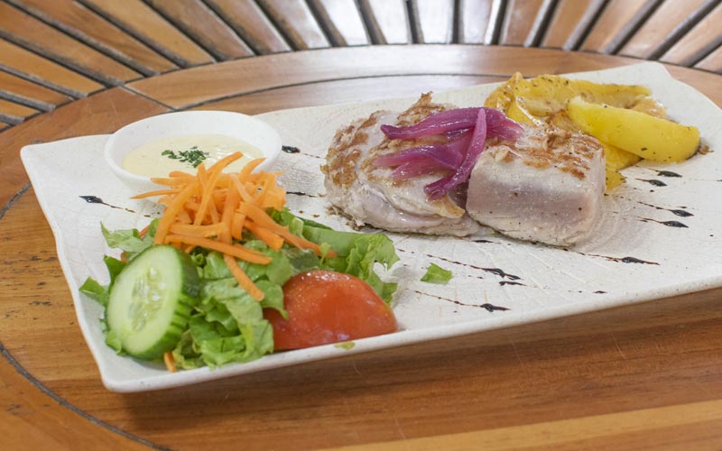 PalmBeach Tropical Restaurant | Tuna with Mango | grilled tuna steak, mango pulp, caramelized red oniongrilled tuna steak on natural charcoal, mango pulp, caramelized red onion, served with mixed salad and baked potatoes